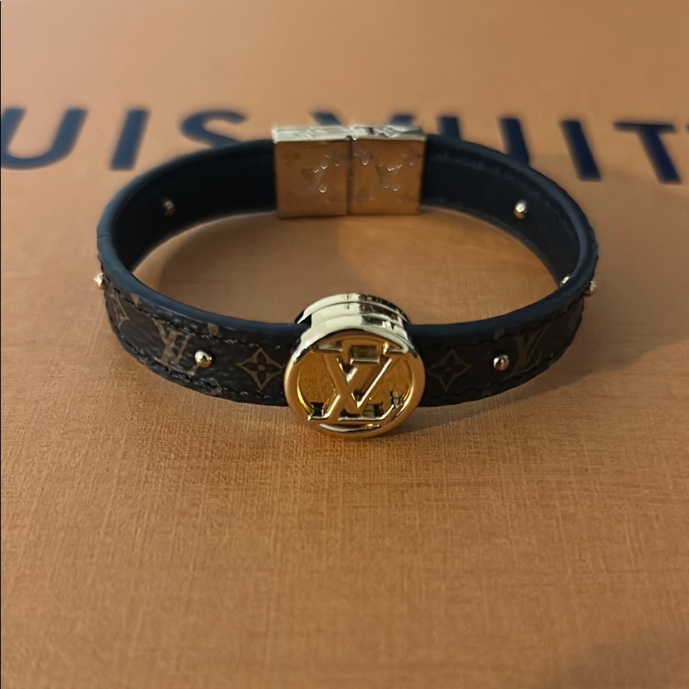 Louis Vuitton Black Bracelet with Gold LV Emblem